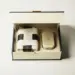 Geöffnete Premium-Geschenkbox mit Saatgut-Kit, Seidenpapier und hochwertiger Markenverpackung in Elfenbein, Anthrazit und Gold.